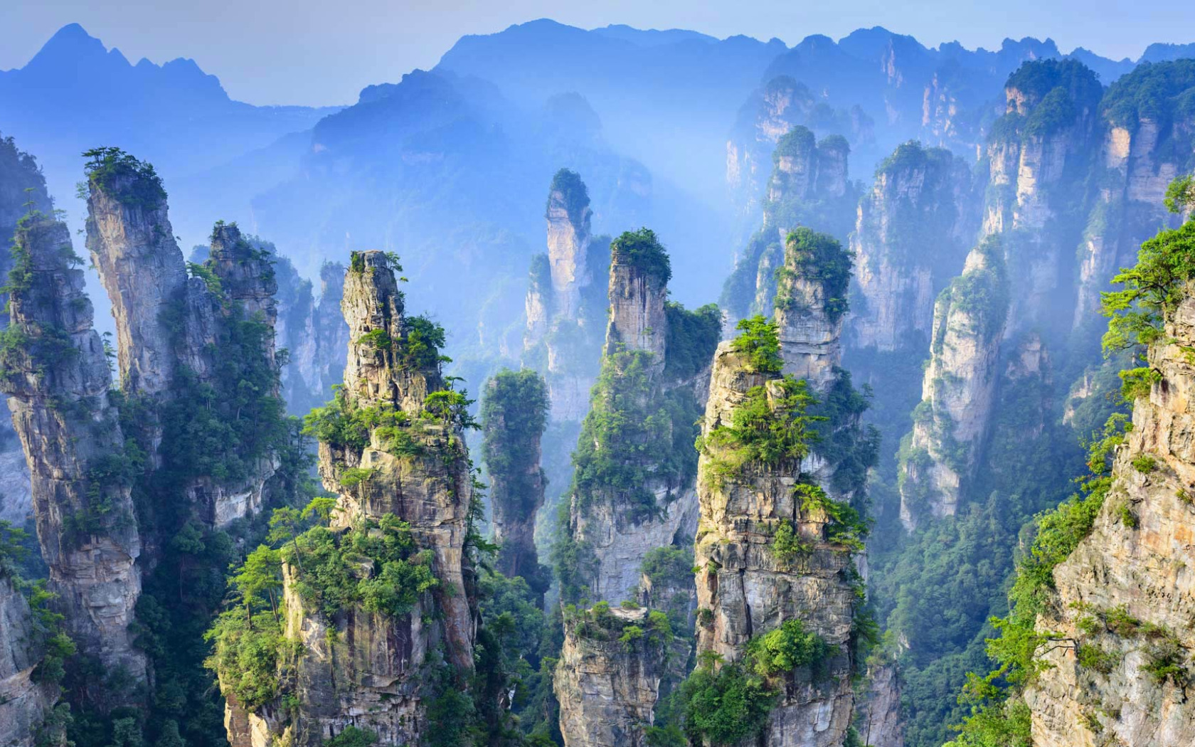 Zhangjiajie National Forest Park in China was the inspiration for the landscapes in the Avatar movies and has often been referred to as the Eight Wonder of the World. (Photo via GoodFon.com)